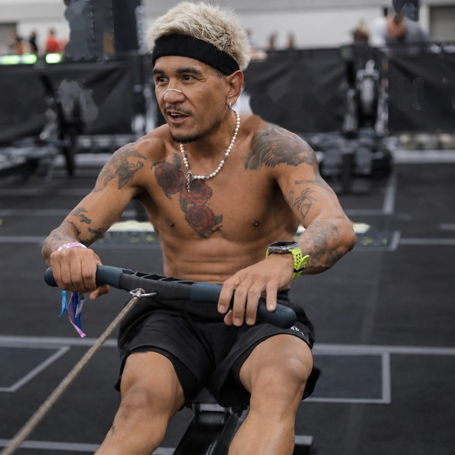 New State founder on a rowing machine during a hybrid training session